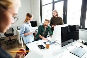 concentrated-colleagues-office-using-computer-scaled-1